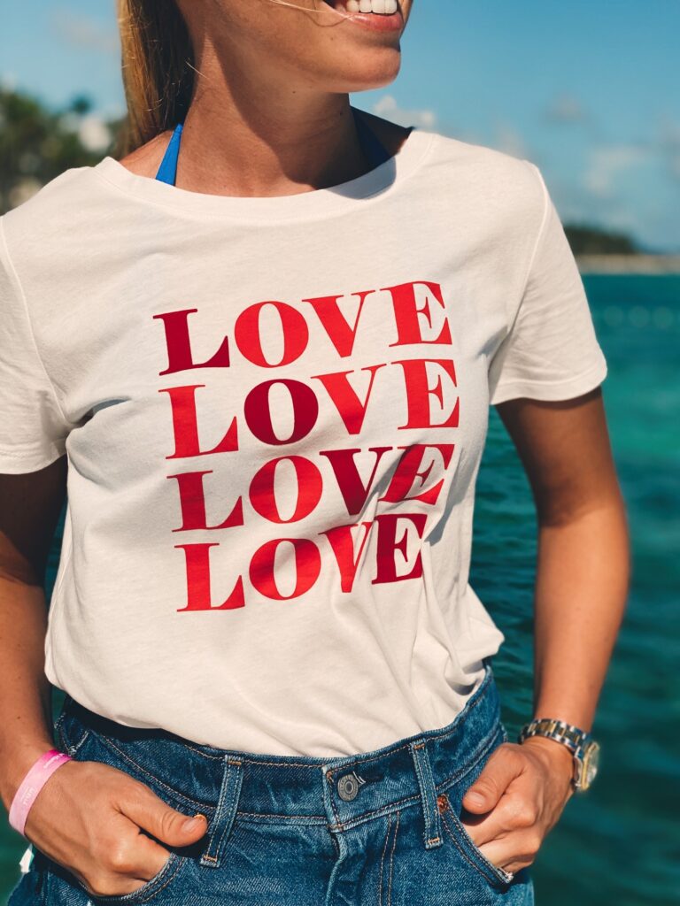 Midsection of woman wearing shirt with love print